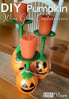 an image of some pumpkins with candles on them