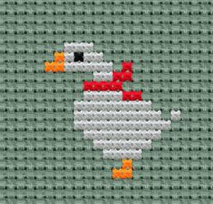 a cross stitch pattern with an orange and white bird on it's face, in the middle of a green background