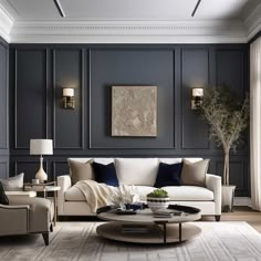 an elegant living room with blue walls and white couches, coffee table and chairs