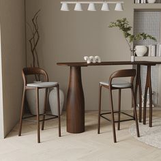 a dining table with two chairs and a vase on the side, in front of a book shelf