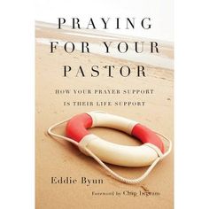 a book cover with a life preserver on the beach and text saying praying for your pastor