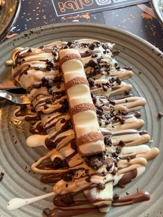 a plate topped with ice cream and chocolate