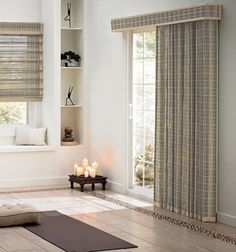 a living room filled with furniture and windows