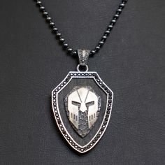 Spartan Helmet necklace is very stylish and quite ideal for everyday use. Engraving details of handmade silver necklace are very detailed and eye-catching. This Spartan Helmet will take a special part in your jewelry collection. This Leonidas Pendant will be a tremendous gift for men who embrace carrying warrior jewelry. * Product details * Gender : Male * Materiel : 925 Sterling Silver * Pendant Diameter : 3.50 x 2.70 cm ( 1.36 x 1.08 inc ) * Bail With : Suitable for up to 6mm Chain * Chain Thi Adjustable Handmade Medieval Necklaces, Handmade Adjustable Medieval Necklaces, Handmade Medieval Black Necklace, Silver Warrior Style Necklace For Gift, Handmade Metal Dog Tag Necklace, Black Warrior Style Jewelry As Gift, Black Warrior Style Jewelry For Gift, Greek Necklace, Warrior Helmet