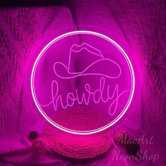 a neon sign with the word hodgy on it in front of a purple background