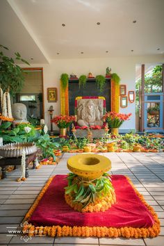 a room filled with lots of different types of flowers and plants on top of tile flooring