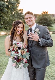 a bride and groom posing for a photo