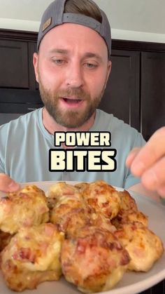 a man holding a plate full of food with the caption power bites on it