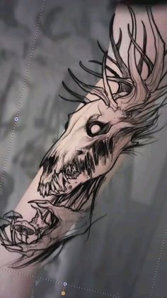 an arm with a dragon tattoo on it's left forearm and the head of a demon