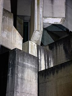 an abstract photograph of concrete blocks and windows