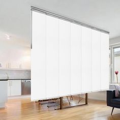 a living room with a couch and sliding glass doors