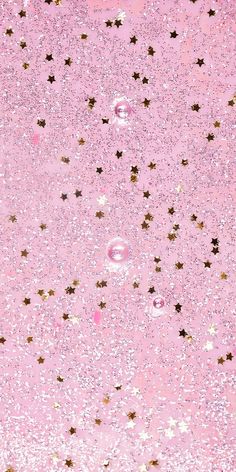 pink and gold glitter background with stars