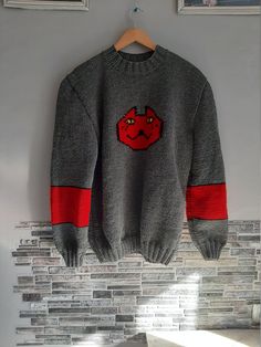 "This listing is for a handmade video game inspired sweater. It is crafted of high quality wool 49% , acrylic 51% blend. Chest Measurements for women Size S - 34- 36\" Size M - 36-38\" Size L - 39-40\" Size XL- 41-42\" Size XXL- 43-44\" If you want it oversize, please, state this in personification section. We will add 3\" for oversize fitting. For custom orders the processing time is 3-4 weeks. Please, feel free to ask any questions as for the custom orders! Thank you for visiting my shop!" Casual Halloween Knit Sweater, Knitted Acrylic Crew Neck Sweatshirt, Gray Knitted Sweater For Streetwear, Casual Knitted Halloween Sweater, Casual Knitted Sweater For Halloween, Acrylic Crew Neck Sweater For Streetwear, Red Acrylic Crew Neck Sweater, Acrylic Crew Neck Knit Sweater, Gray Knit Sweater With Crew Neck