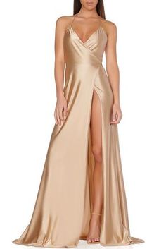 This classic timeless cut is a staple piece for any socialite. Made of the finest jersey material form fitting and flowy. Features a low back, high slit with wrap front that adjust to fit on waist lin                                                                                                                                                                                 More Champagne Prom Dress, Prom Dress With Slit, Styles Dress, Gorgeous Gowns, Ladies Dress Design, Elie Saab, Gold Dress, Formal Gowns, Look Chic