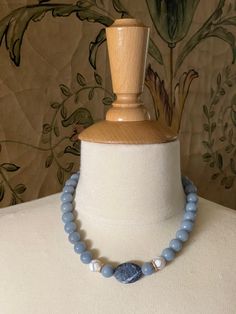 Blue Jade and White Giraffe Beaded Necklace with Sodalite Center Stone Measures 16" with Toggle Closure Finish Matte Gold 18KT Gold Plated Made In The USA Style Number DN184 Blue Beaded Jade Necklaces, Beaded Turquoise Agate Necklace, Turquoise Agate Beaded Necklace, Blue Agate Beaded Necklace, Blue Agate Polished Bead Necklaces, White Giraffe, Blue Jade, Matte Gold, Jade