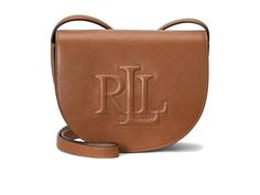 LAUREN Ralph Lauren Leather Medium Witley Crossbody - Cross Body Handbags : Brown : Enjoy an equal dose of elegance and functionality as you carry your belongings in the LAUREN Ralph Lauren Leather Medium Witley Crossbody. Crafted in full-grain leather, this streamlined bag features an oversized iconic debossed logo and a magnetic snap closure at the flap, an adjustable crossbody strap, one exterior slip pocket, and one interior slip pocket. Cotton lining. Imported. Measurements: Depth: 3 in Height: 6 1 2 in Please note, the hardware color and interior lining may differ from the color shown in the photo. Ralph Lauren Crossbody Bag, Luxury Ralph Lauren Brown Shoulder Bag, Brown Leather Ralph Lauren Shoulder Bag, Elegant Ralph Lauren Crossbody Bag, Ralph Lauren Leather Crossbody Shoulder Bag, Ralph Lauren Leather, Debossed Logo, Back Bag, Lauren Ralph Lauren