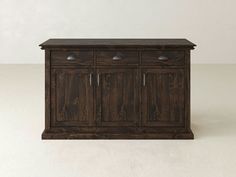 a wooden cabinet sitting on top of a white floor