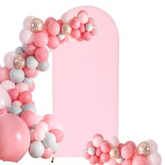 a pink and white balloon arch with balloons