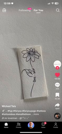 an image of a flower drawn on the side of a wall with text below it