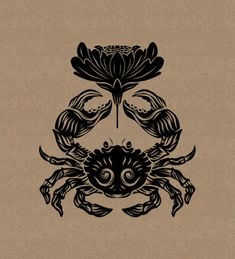 a black crab on brown paper with an intricate design in the center and two smaller crabs below it