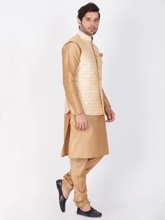 Vastramay Rose Gold Silk Blend Baap Beta Jacket Kurta Pyjama set A stunning combination of traditional and contemporary style, the Vastramay Rose Gold Silk Blend Baap Beta Jacket Kurta Pyjama Set is a must-have for special occasions. Crafted from high-quality silk blend fabric, this set features a kurta with intricate detailing paired with comfortable pyjamas and a matching jacket. Make a statement with this elegant ensemble. Features: Includes a kurta, pyjama, and jacket Made from premium silk blend fabric Exquisite embroidery and embellishments Perfect for festive and celebratory occasions Specifications: Brand: Vastramay Color: Rose Gold Material: Silk Blend Sleeve Type: Full Sleeves Occasion: Festive, Party Material & Care: Silk Blend. Dry clean only. Legal Disclaimer: The product is g Kurta Pyjama, Comfortable Pajamas, Boys Wear, Gold Silk, Full Sleeves, Pyjama Set, Gold Material, Full Sleeve, Sleeve Type