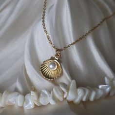 Clam Necklace, Pearl and Shell Necklace, Mermaid Jewelry for Her, Mermaidcore Jewelry, Shell Jewelry, Gift for Her, Ocean Jewelry ☽ 16K Gold Plated, Acrylic Pearl (12x15mm) ☽ This is a gold plated charm meaning that it requires extra care to keep its shine and color intact. Please follow these tips to make the charm last longer in its original condition: avoid wearing it to the beach, pool, shower, bathtub, hot tub; avoid it touching any lotions, creams, or sweat; take it off before going to bed Pearl In Shell Necklace, Pearl Clam Necklace, Mermaid Jewelry Necklaces, Clam Shell Necklace, Gold Ocean Jewelry, Mermaid Jewelry Aesthetic, Mermaidcore Jewelry, Clam Necklace, Mermaid Jewlery