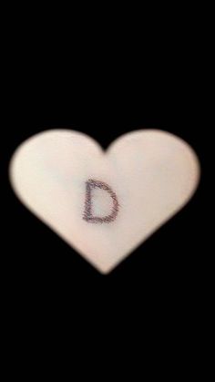 a heart shaped object with the letter d on it