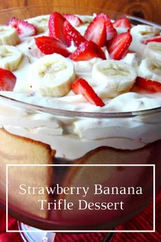 strawberry banana trifle dessert in a glass dish on top of a red table cloth