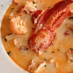 there is a lobster soup in the bowl