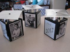 three cubes with pictures on them sitting on a table