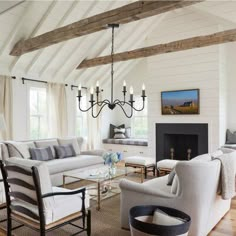 a living room filled with furniture and a fire place