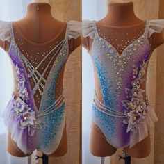 the back of a ballet leotard with sequins and flowers on it