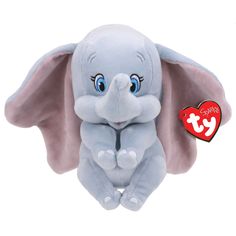 an elephant stuffed animal sitting on top of a white surface with a red heart hanging from it's side