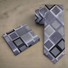 Exquisite Silk Necktie: A Study in Silver, Grey, and Black Geometry In the world of men's fashion, the necktie serves as an emblem of sophistication and a medium for expressing individual style. For those seeking an accessory that seamlessly combines classic elegance with contemporary flair, our Exquisite Silk Necktie in Silver, Grey, and Black, adorned with a bold geometric diamond pattern, is the embodiment of refined artistry. Dive into the details of this necktie that strikes the perfect bal Classic White Dress, Light Grey Suits, Geometric Diamond Pattern, Confident Style, Black Tie Affair, King Tut, Romantic Evening, Geometric Diamond, Tie Set