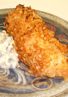 a close up of a plate of food with chicken and mashed potatoes on it