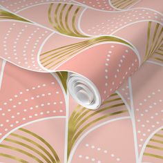 a pink and gold wallpaper with white dots on it's edges, in an abstract pattern