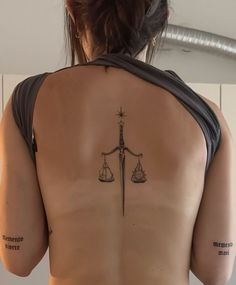 Siren Back Tattoo, Back Tattoo Women Symmetrical, Spine Dagger Tattoo, Dagger Arm Tattoo, Knife Spine Tattoo, Tattoos That Represent Independence, Dagger Back Tattoo, Christian Spine Tattoo, Dagger Spine Tattoo