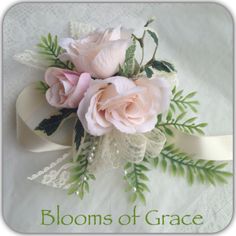 a bouquet of pink roses and greenery on a white background with the words blooms of grace written below it