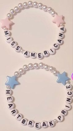 two bracelets with words and stars are shown on a white surface, one is for children