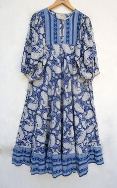 "ITEM DESCRIPTION blue paisley printed cotton long maxi dress - Henley neckline with button maxi dress - 3/4th sleeve with button maxi dress Features: 3/4th sleeve, Henley neck, Long dress Material: Cotton cambric Fabric: 100% cotton soft light weight ethnic print fabrics  Sleeve Length = 18 inch For more sizes & their measurement, please refer our below chart to understand the sizes variations available with us For your size requirement, please mention your size in seller note at the time of bu Blue Paisley Print Bohemian Midi Dress, Blue Cotton Maxi Dress With 3/4 Sleeves, Blue Bohemian Half Sleeve Maxi Dress, Blue Bohemian Maxi Dress With 3/4 Sleeve, Bohemian Half Sleeve Cotton Maxi Dress, Bohemian Half-sleeve Cotton Maxi Dress, Black Bridal Dresses, Button Maxi Dress, Dress Book