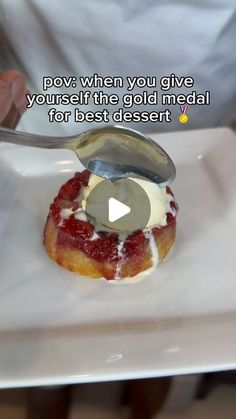 a person holding a spoon over a donut on a white plate with the words pov when you give yourself the gold medal for best dessert