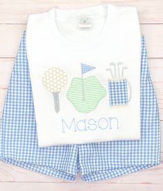 Our golf trio applique shirt and bodysuit are made from summer fabrics in green, blue, & tan. Add your little one's name for the perfect finishing touch. Can match with a pair of blue seersucker gingham shorts. Our white boutique shirts and bodysuits are the highest quality on the market. They are thick & beautifully constructed. They run true to size. We recommend to size up if unsure. Our shorts are made from beautiful, high quality, thick fabric. They have a flat band front & an e Fitted Golf T-shirt For Summer, Fitted Summer Golf T-shirt, Green Summer Golf Top, Preppy Cotton Tops For Golf, Green Cotton Golf T-shirt, Green Cotton T-shirt For Golf, Blue Cotton Golf T-shirt, White Boutique, Boys Golf