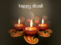 happy diwali greetings with lit candles on the occasion of diwali