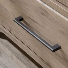 a close up of a drawer with a handle on it