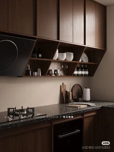 a kitchen with wooden cabinets and black counter tops, along with white dishes on the shelves