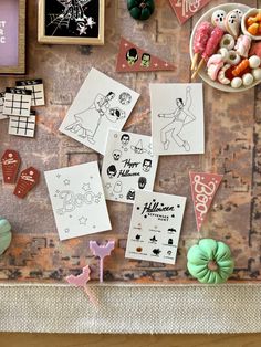 various items are displayed on a table with buttons and magnets in the shape of people