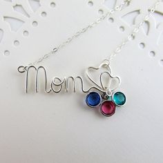 Shop: www.deannewatsonjewelry.etsy.com Show your mom how much you appreciate her with a custom birthstone necklace. This necklace is a great idea for grandmothers too! Hand wire wrapped pendant in sterling filled silver with dainty sterling silver chain. Birthstone charms are perfect for moms and grandmothers - just add a crystal for each child. * Choose from 0-4 crystals from the drop down menu.  Sterling silver plated or gold plated Swarovski crystal birthstone charms (See photo 3) - Remember Sterling Silver Birthstone Necklace With Custom Name For Mom, Sterling Silver Birthstone Necklace For Mom, Adjustable Nickel Free Birthstone Necklace For Mother's Day, Customizable Sterling Silver Birthstone Necklace For Mom, Custom Name Birthstone Necklace For Mother's Day, Mother's Day Custom Name Sterling Silver Birthstone Necklace, Mother's Day Sterling Silver Birthstone Necklace With Custom Name, Handmade Birthstone Necklace For Anniversary On Mother's Day, Handmade Birthstone Necklace For Anniversary, Mother's Day