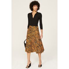 Orange animal print crepe (100% Polyester). A-line. Side zipper closure. Imported. Silk Wrap Skirt, Fitted Midi Skirt, Dvf Diane Von Furstenberg, Color Block Skirt, Black Pleated Skirt, Black And White Skirt, Brown Skirts, Printed Midi Skirt, Crochet Skirt