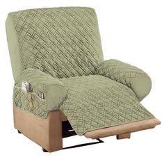 a recliner chair covered in a quilted green cover with a pillow on it