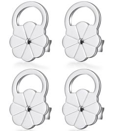 four pieces of white metal with flowers on them